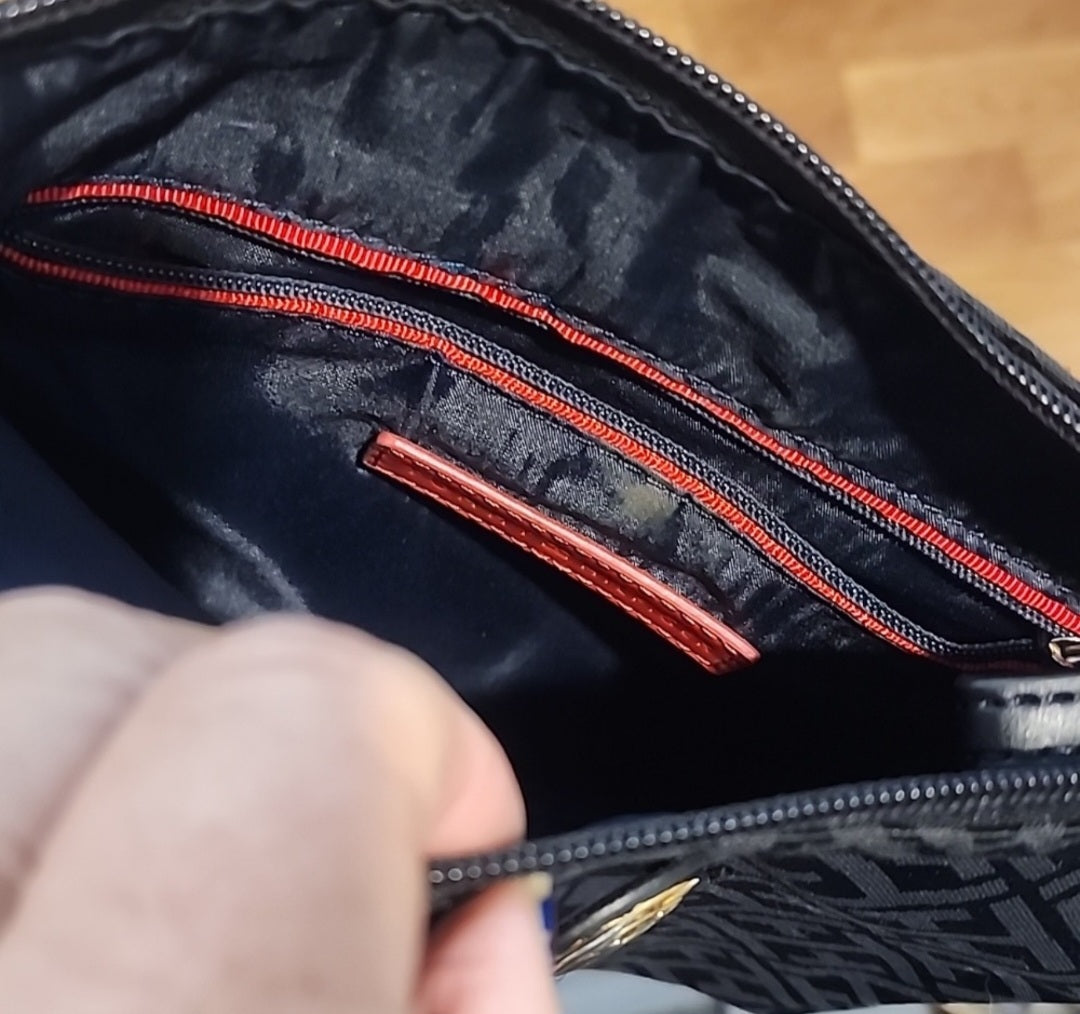 Tommy Hilfiger black crossbody bag is perfect for any occasion.