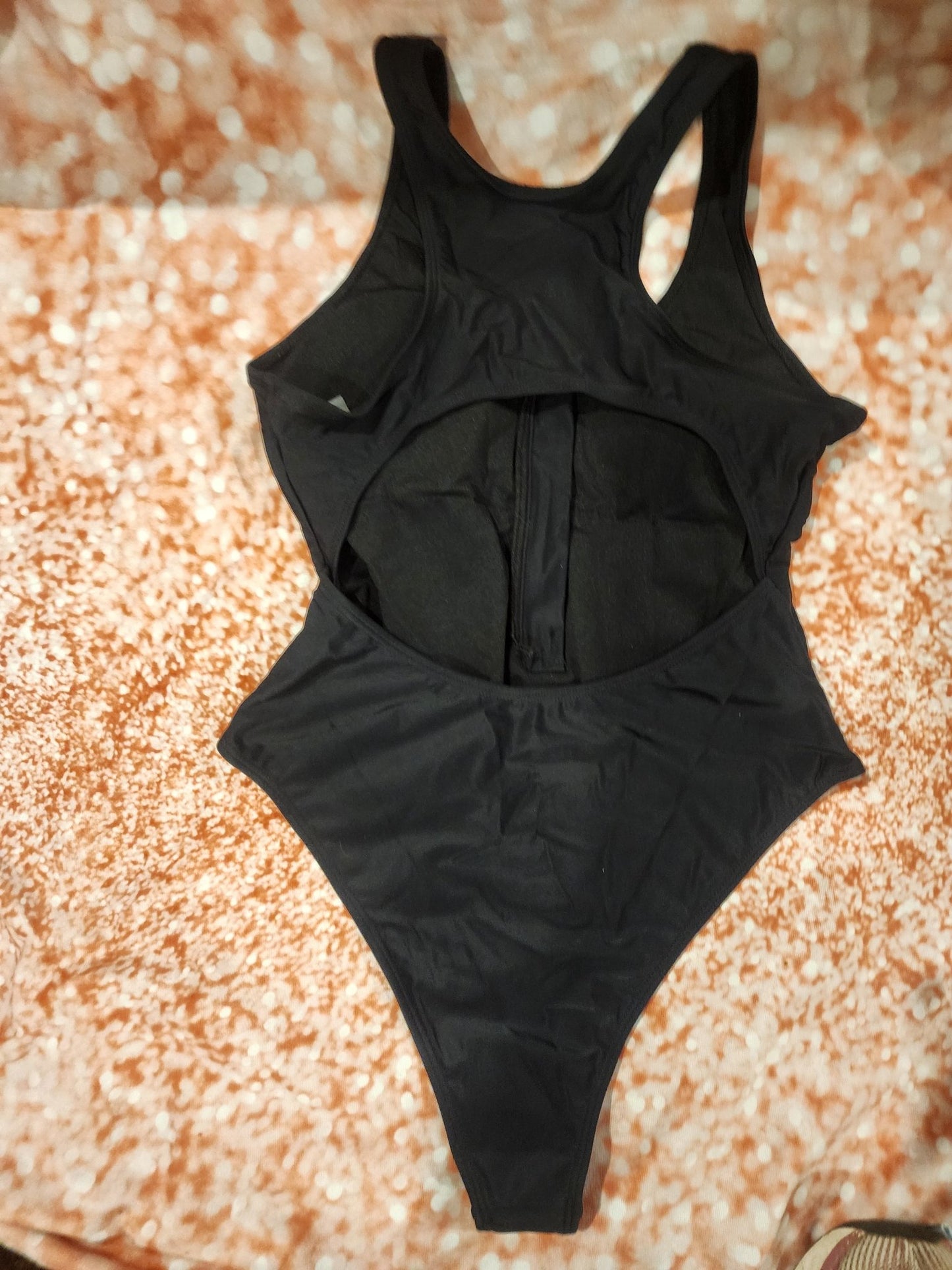 Sleek and stylish black one - piece swimsuit, perfect for the beach or pool L - I Bought a Yard Sale