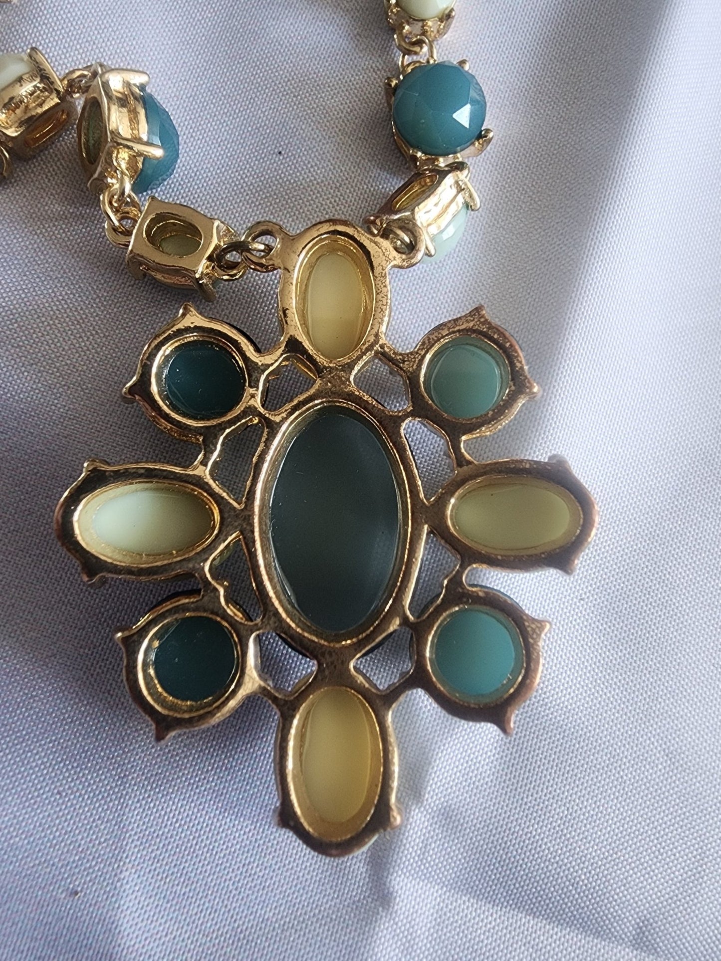 This vintage necklace features a stunning cluster of teal and cream stones - I Bought a Yard Sale